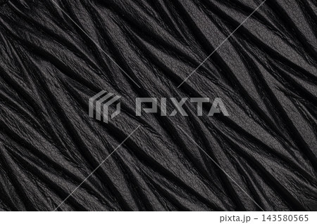Dark black wrinkled leather fabric texture Dark black wrinkled leather fabric texture 143580565
