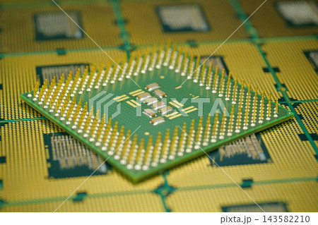 Close up of computer CPU showing micro pin grid for stable motherboard connection 143582210