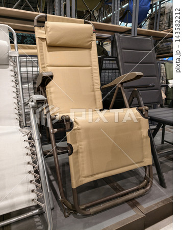 Folding chairs for fishing and tourism in hypermarket showcase offer convenient portable seating solution with strong frame lightweight build and outdoor ready functionality for users Folding chairs for fishing and tourism in hypermarket showcase offer convenient portable seating solution with strong frame lightweight build and outdoor ready functionality for users 143582212