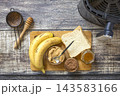 Ingredients for cooking toast bread with peanut butter and fried banana in kitchen gadget modern air fryer. Lifestyle trendy of new cooking. 143583166