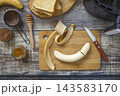 Step 3. Cooking toast bread with peanut butter and fried banana in an air fryer, in kitchen gadget modern. Lifestyle trendy of new cooking. Healthy cooking with air fryer. 143583170