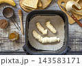 Step 4. Cooking toast bread with peanut butter and fried banana in an air fryer, in kitchen gadget modern. Lifestyle trendy of new cooking. Healthy cooking with air fryer. 143583171