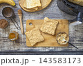 Step 6. Cooking toast bread with peanut butter and fried banana in an air fryer, in kitchen gadget modern. Lifestyle trendy of new cooking. Healthy cooking with air fryer. 143583173