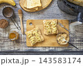 Step 7. Cooking toast bread with peanut butter and fried banana in an air fryer, in kitchen gadget modern. Lifestyle trendy of new cooking. Healthy cooking with air fryer. 143583174