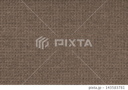 Texture of brown waffle weave kitchen towel. Cloth, fabric with checked pattern, grid design 143583781