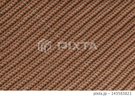 Close up, macro brown knitted fabric texture with diagonal yarn stitches, cloth wool background Close up, macro brown knitted fabric texture with diagonal yarn stitches, cloth wool background 143583821