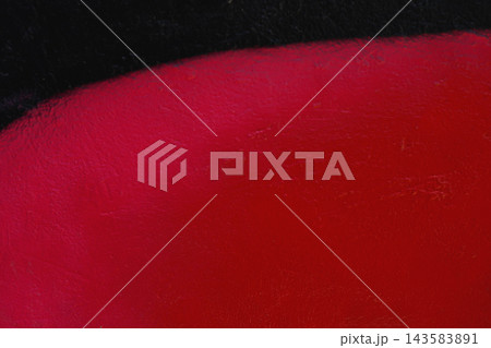 Abstract close-up of red black painted wall texture, curved edge. Minimalist abstract background, macro detail, bright red spray paint over dark black textured surface, smooth diagonal curved boundary Abstract close-up of red black painted wall texture, curved edge. Minimalist abstract background, macro detail, bright red spray paint over dark black textured surface, smooth diagonal curved boundary 143583891