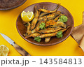 Seafood dish of golden breaded capelin 143584813