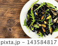 Mussels with Fresh Herbs and Greens 143584817