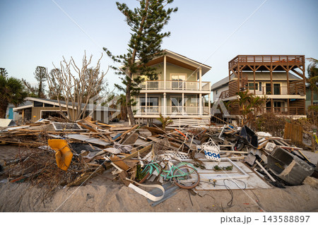 Piles of garbage from severely damaged homes after hurricane Milton storm surge in Florida. Debris on street side on Manasota Key in Englewood. Hurricane aftermath cleanup Piles of garbage from severely damaged homes after hurricane Milton storm surge in Florida. Debris on street side on Manasota Key in Englewood. Hurricane aftermath cleanup 143588897