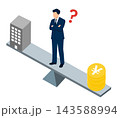 建物とお金の間で悩む男性のイラスト 143588994