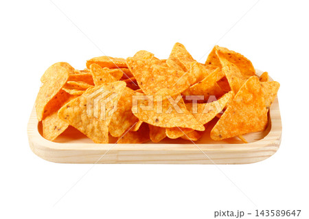 Crispy, seasoned triangular corn tortilla chips on a wooden tray, isolated on a white background. Mexican cuisine. 143589647