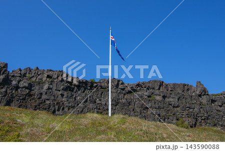 Icelandic flag flying at Law Rock in Thingvellir National Park Icelandic flag flying at Law Rock in Thingvellir National Park 143590088