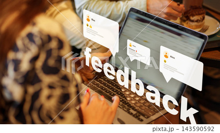 Engagement with feedback through a laptop at a cafe setting during the day Engagement with feedback through a laptop at a cafe setting during the day 143590592
