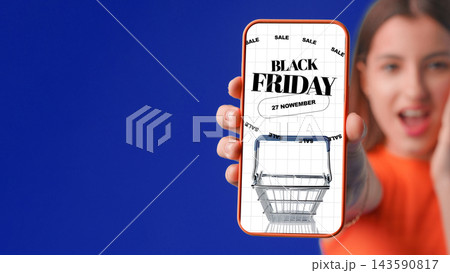 Black Friday sale on November 27 with sale announcement from a person holding a smartphone Black Friday sale on November 27 with sale announcement from a person holding a smartphone 143590817