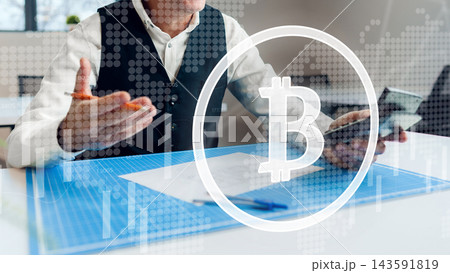 Business person discussing cryptocurrency trends while showing a mobile device in a modern office setting 143591819