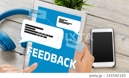 Feedback on digital device with messages and smartphone in modern workspace setting Feedback on digital device with messages and smartphone in modern workspace setting 143592183