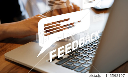User provides feedback while typing on a laptop in an office environment User provides feedback while typing on a laptop in an office environment 143592197
