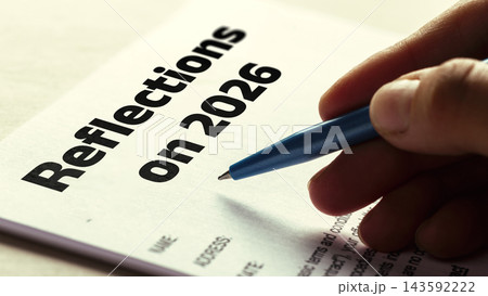 Reflections on 2026 document being filled out with a blue pen in 2027 Reflections on 2026 document being filled out with a blue pen in 2027 143592222