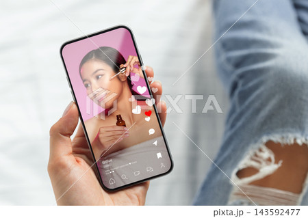 Engaging in social media chats and calls while enjoying a skincare routine at home Engaging in social media chats and calls while enjoying a skincare routine at home 143592477