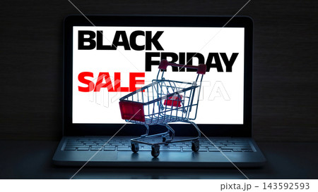 Black Friday sale with shopping cart on laptop screen showing discount offers 143592593