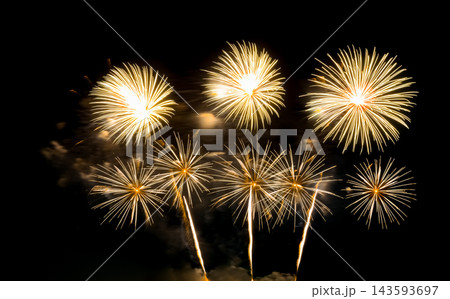 Golden firework sparkling on black background for celebration and anniversary Golden firework sparkling on black background for celebration and anniversary 143593697