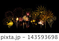 Fireworks of various colors and shapes burst in night sky 143593698