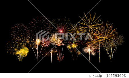 Fireworks of various colors and shapes burst in night sky 143593698
