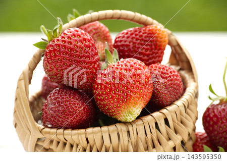 Fresh Red Strawberries in Woven Basket Close-Up Ready to Eat Summer Fruit Snack 143595350