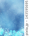 A Christmas background with bokeh and snowflakes in blue tones. 143595695