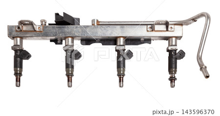 Close-up on a car fuel injector for supplying gasoline to cylinder engine on a white isolated background. Spare parts catalog Close-up on a car fuel injector for supplying gasoline to cylinder engine on a white isolated background. Spare parts catalog 143596370