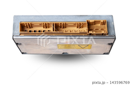 Plastic car engine control unit with metal elements on a white isolated background is the connecting center of various subsystems, units and assemblies. Monitoring the state of the moment. Spare part. 143596769