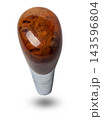 Wooden handle for shifting automatic gears of the car. Decorative details on a black background 143596804