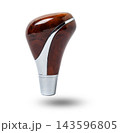 Wooden handle for shifting automatic gears of the car. Decorative details on a black background 143596805