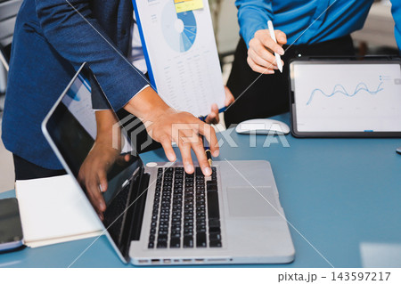 Business professional analyzing financial data on digital tablet dashboard with calculator and laptop, representing accounting software, ERP system integration, performance monitoring. Business professional analyzing financial data on digital tablet dashboard with calculator and laptop, representing accounting software, ERP system integration, performance monitoring. 143597217