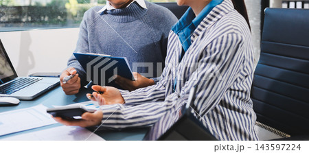 Business professional analyzing financial data on digital tablet dashboard with calculator and laptop, representing accounting software, ERP system integration, performance monitoring. Business professional analyzing financial data on digital tablet dashboard with calculator and laptop, representing accounting software, ERP system integration, performance monitoring. 143597224