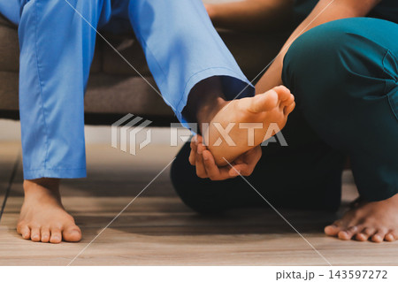 Physiotherapist working with patients in clinic, 143597272