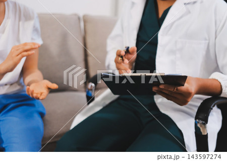 Asian female patient crying while consulting her health problem 143597274