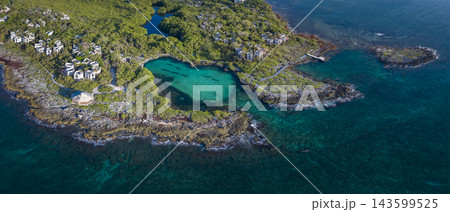 An abandoned resort in Cancun blend into the turquoise Caribbean Sea 143599525