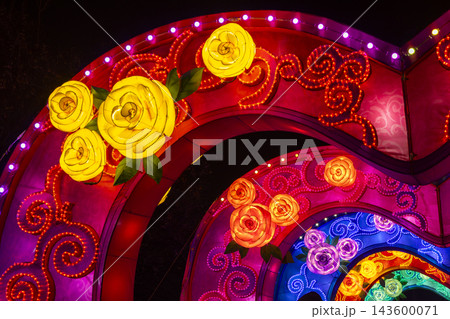 Colorful glowing lanterns forming a floral arch at night Colorful glowing lanterns forming a floral arch at night 143600071