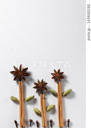 Mulled wine preparation ingredients flat lay showcasing natural textures of spices 143600298