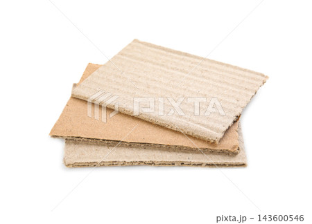 Pieces of brown cardboard isolated on white 143600546