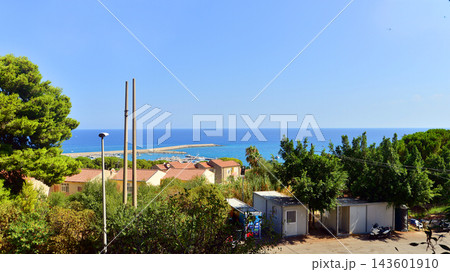 Cefalu, Italy. 22 August 2026. Buildings situated on a hillside in a picturesque corner of Sicily. 143601910