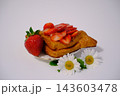 Golden puff pastry with fresh strawberries and strawberry filling close up on white background homemade summer bakery delight 143603478