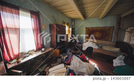 Abandoned messy room showing clutter, neglect and disorganization in a forgotten home Abandoned messy room showing clutter, neglect and disorganization in a forgotten home 143603897