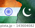 India and Pakistan flags painted on distressed concrete separated by a deep crack, symbolizing geopolitical tension, divided border, strained relations and fragile prospects for peace 143604082