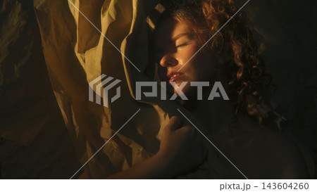 Woman Between Light and Darkness Representing Emotional Duality and Inner Conflict Woman Between Light and Darkness Representing Emotional Duality and Inner Conflict 143604260