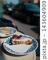 Slice of delicious cake with fresh blueberries on a plate in a cafe 143604909