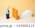 Solid brick wall blocking office worker from starting a career or personal growth, mental barrier concept. Workplace obstacles and psychological barriers can limit career advancement 143606219