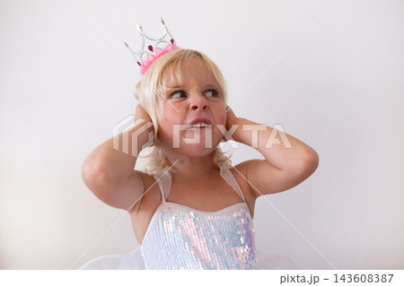 Disgusted Little Blonde Girl Wearing Princess Crown and Dress Pinching Nose Disgusted Little Blonde Girl Wearing Princess Crown and Dress Pinching Nose 143608387